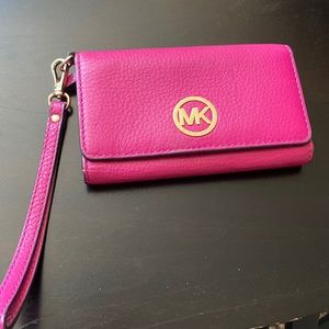 Fuschia Michael Kors wallet with wrist strap